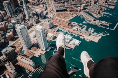 doors-off-helicopter-tour-boston-feet-dangling-over-skyline