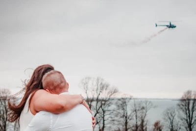 couple-hugging-during-helicopter-gender-reveal