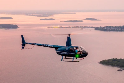 helicopter-flying-above-boston-harbor-islands-coastline