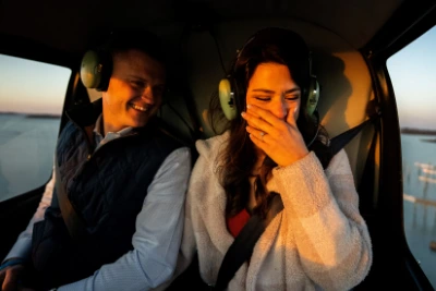 couple-smiling-during-helicopter-proposal-flight