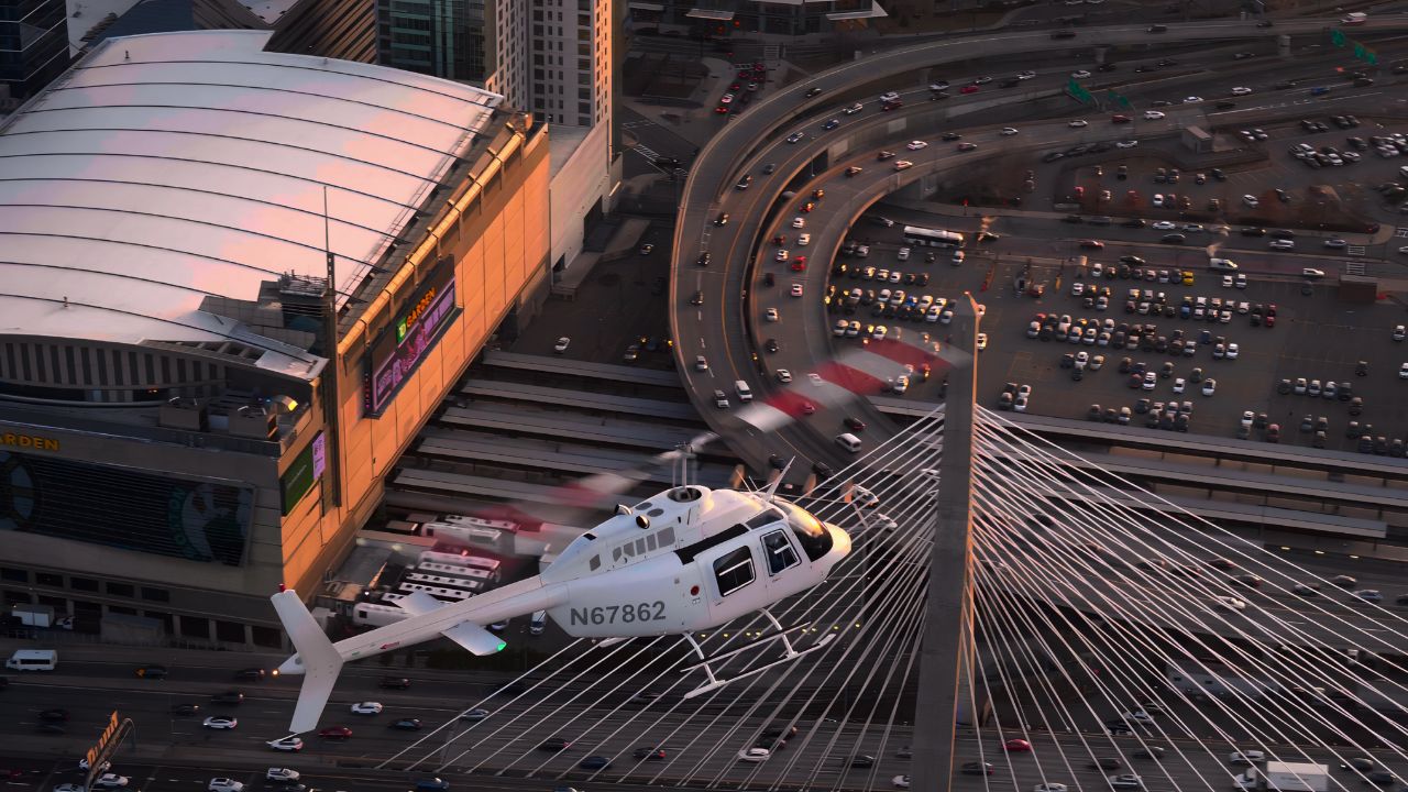 a helicopter flies above downtown Boston