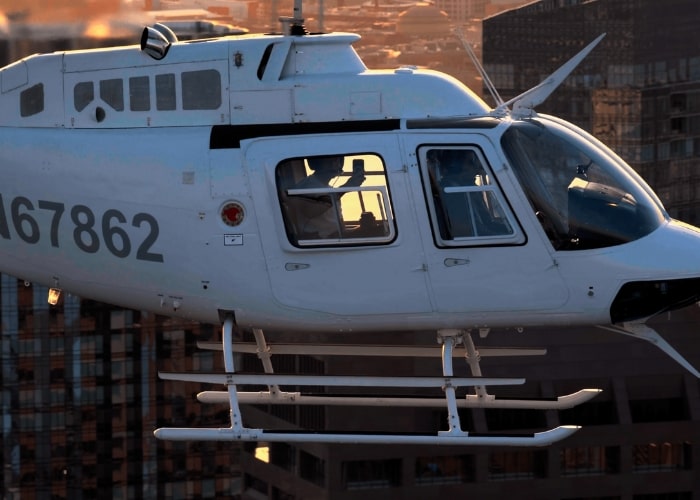 a helicopter flying over a city