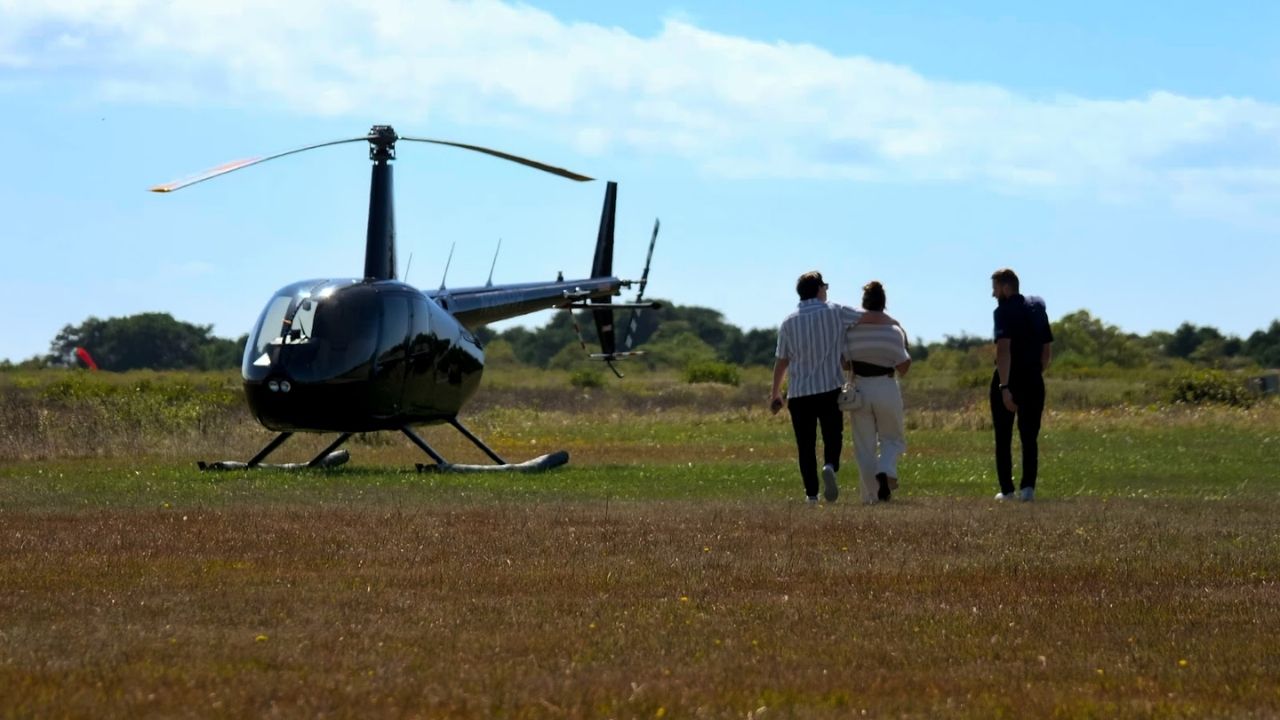 Private helicopter charter waiting as guests arrive, showing how seamless transport sets the tone for a refined Nantucket day trip.