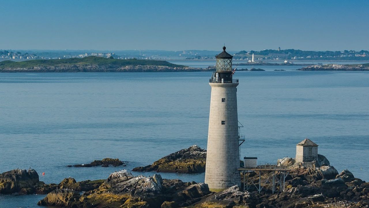 Stunning view of a Cape Cod lighthouse overlooking the sea