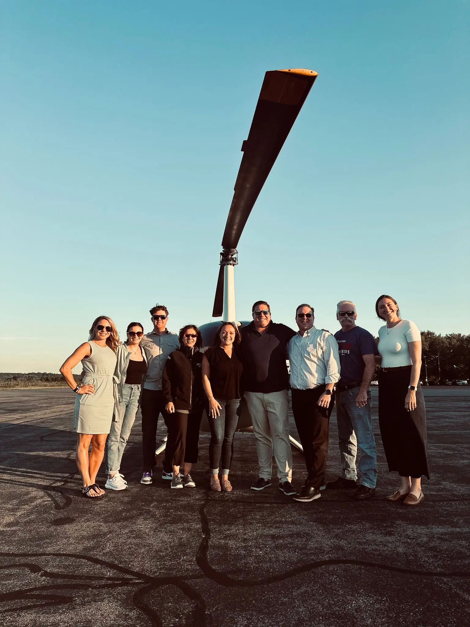 Corporate team preparing for a fun helicopter adventure event together