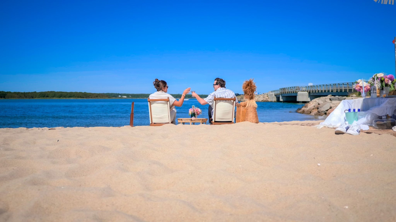 Couple enjoying a sunny day together at the beach with relaxing coastal views and a peaceful vacation atmosphere.