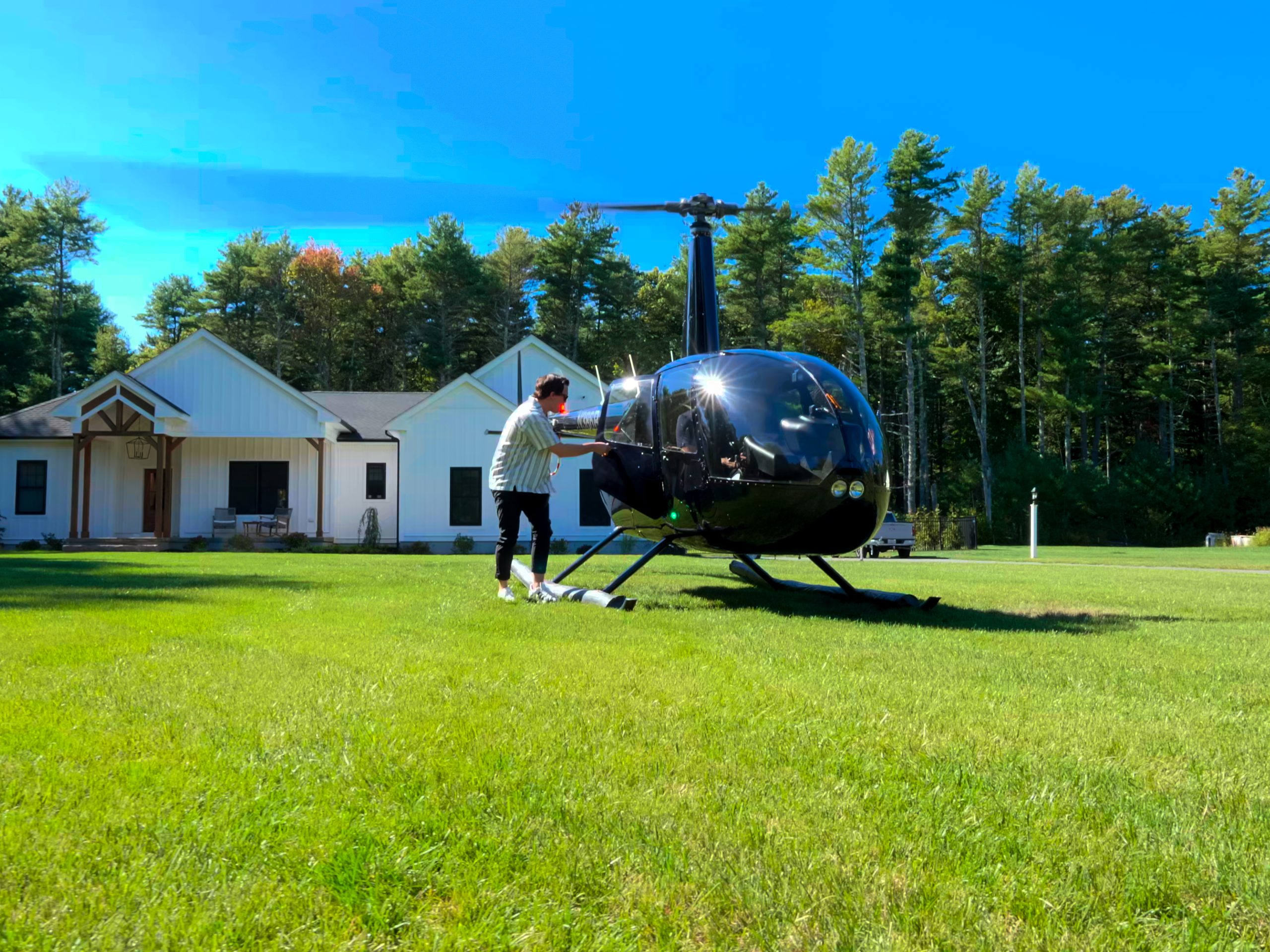 Passenger boarding a helicopter charter.